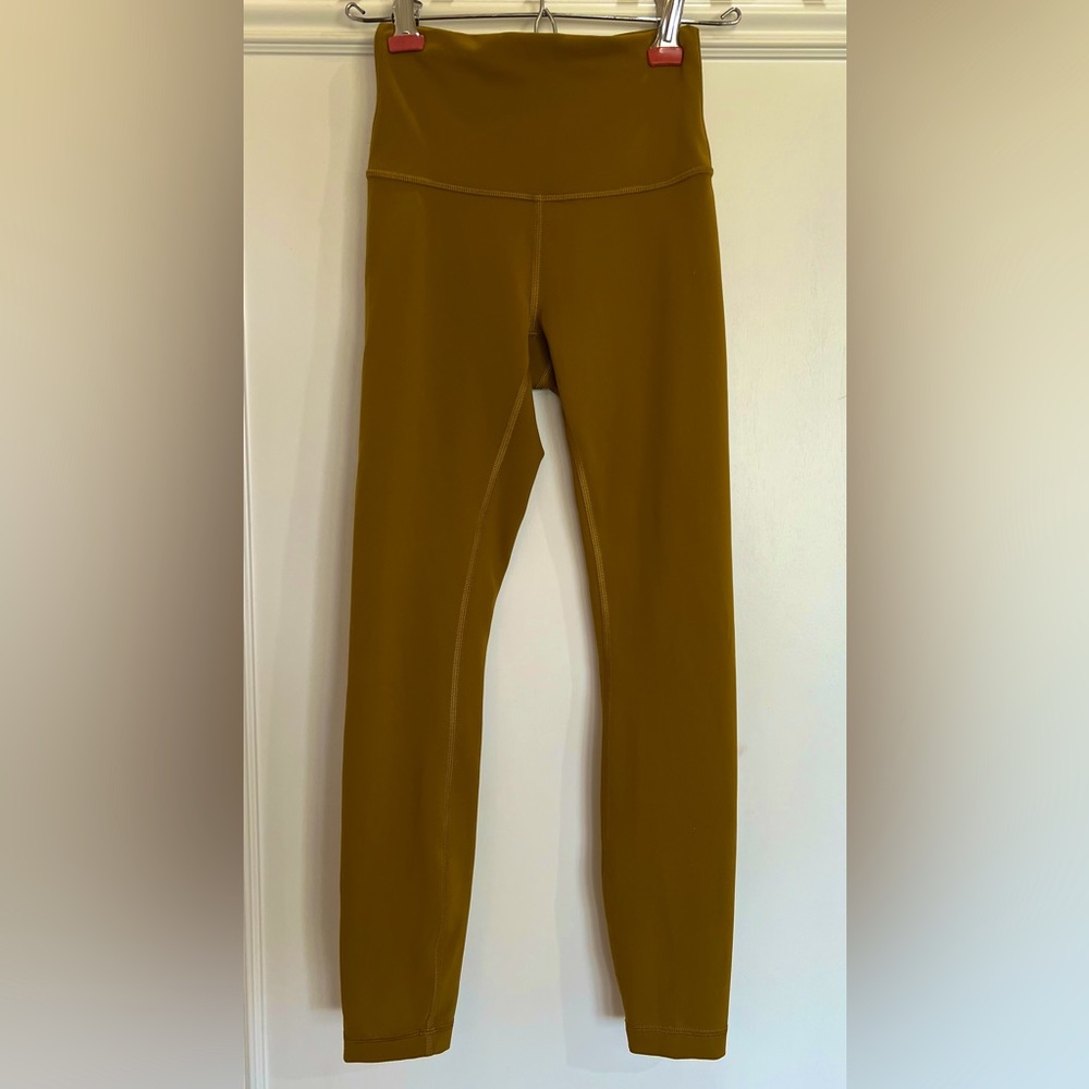 Lululemon Women’s Wunder Train High Rise Tight. Size 2. Color- gold/yellow
